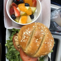 Grilled chicken sandwich with fresh fruit. Grilled chicken sandwich with fresh fruit.