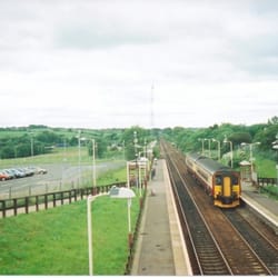 Greenfaulds Railway Station - A view from the footbridge - note the largely empty car park and the long paths down from the bridge to the platform.