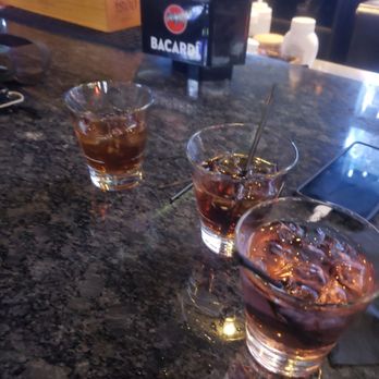 The Temple Charlotte - two glasses of alcohol on a bar - Lounges Near Me - Charlotte, North Carolina The Temple Charlotte - two glasses of alcohol on a bar - Lounges Near Me - Charlotte, North Carolina