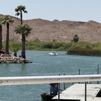 Rio Loco - View from patio as a boat leaving the docks - Fish & Chips Near Me - Martinez Lake, Arizona Rio Loco - View from patio as a boat leaving the docks - Fish & Chips Near Me - Martinez Lake, Arizona