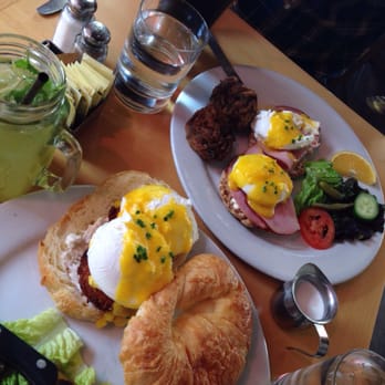 Blue Daisy - Salmon scandia (poached eggs on salmon cakes on a toasted croissant), and ham Benedict (which comes with zucchini hash browns) - Creperies Near Me - Santa Monica, California Blue Daisy - Salmon scandia (poached eggs on salmon cakes on a toasted croissant), and ham Benedict (which comes with zucchini hash browns) - Creperies Near Me - Santa Monica, California