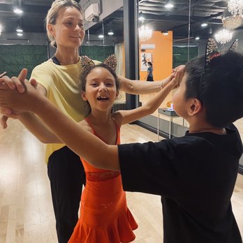 OC Dancing Ballroom Studio - Studio Coach Oksana during private lesson with kids - Performing Arts Near Me - Irvine, California