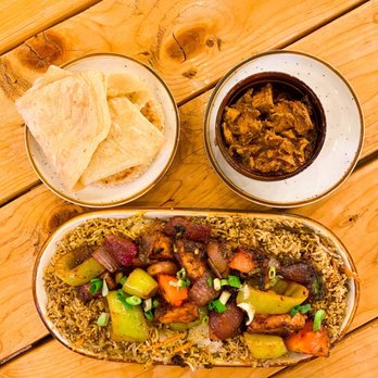 Mirisata - a plate of food and a bowl of chips - Sri Lankan Near Me - Portland, Oregon