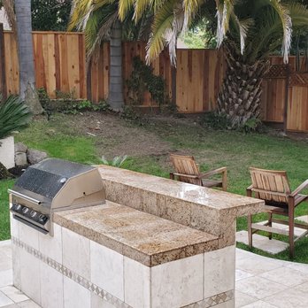 A Tamam Construction - before. half dead grass and broken pavers, ugly vines and a half retainer wall. - General Contractors Near Me - Fremont, California