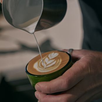 23 West Coffee - a latte being poured into a cup - Coffee & Tea Near Me - St. Louis, Missouri 23 West Coffee - a latte being poured into a cup - Coffee & Tea Near Me - St. Louis, Missouri