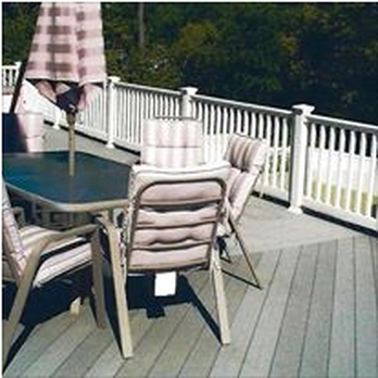 Acco Home Improvements - a deck with a table and chairs - General Contractors Near Me - Frederick, Maryland Acco Home Improvements - a deck with a table and chairs - General Contractors Near Me - Frederick, Maryland