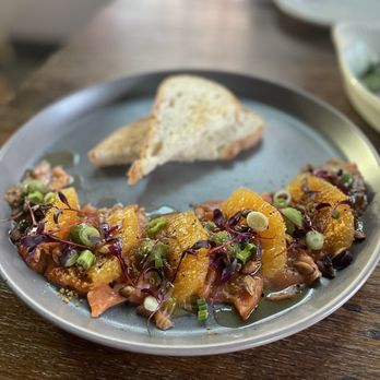 Mimo - a plate of food on a wooden table - Italian Near Me - Houston, Texas