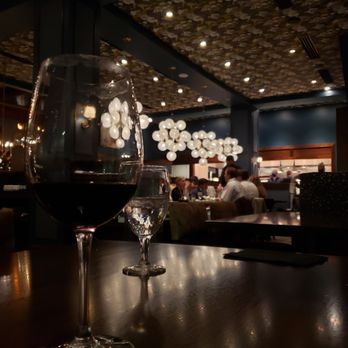 William & Henry Steakhouse - a glass of wine on a table - Steakhouses Near Me - Lynchburg, Virginia William & Henry Steakhouse - a glass of wine on a table - Steakhouses Near Me - Lynchburg, Virginia