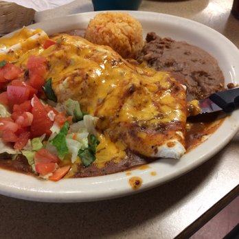 Las Carretas - Monster guisado burrito with refrito, rice and salad -- delicious!! - Mexican Near Me - San Antonio, Texas