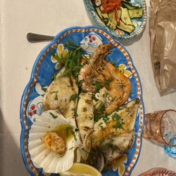 Trattoria Pizzeria La Mela - 30 euro ( seafood platter with scallop, cuttlefish, shrimp, sea bass , sea bream). Side of grilled vegetable 6 euro