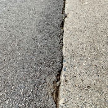 Jellisons Best Blacktop - Crumbling due to grade started too high causing puddling and freezing in the winter. - Snow Removal Near Me - Carver, Minnesota Jellisons Best Blacktop - Crumbling due to grade started too high causing puddling and freezing in the winter. - Snow Removal Near Me - Carver, Minnesota