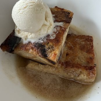 The Temple Kitchen + Bar - Bourbon bread pudding with a scoop of vanilla ice cream cream - Beer Bar Near Me - Hilo, Hawaii The Temple Kitchen + Bar - Bourbon bread pudding with a scoop of vanilla ice cream cream - Beer Bar Near Me - Hilo, Hawaii