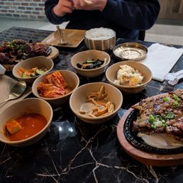 spicy pork combo (top left), la galbi combo (bottom right) spicy pork combo (top left), la galbi combo (bottom right)