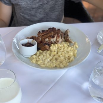 Saddle Peak Lodge - Young mans pork chop & non jalapeño Mac & cheese. He loved it. The bacon relish was as good as it sounds - New American Near Me - Calabasas, California