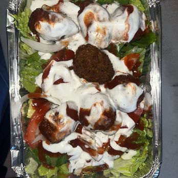 DC Falafel - Falafel platter with lettuce, topped with garlic and spicy sauces - Middle Eastern Near Me - Washington, DC, District of Columbia