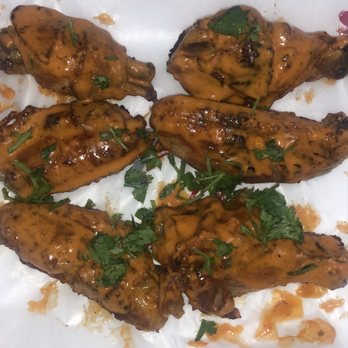 Chicky's - Chicken Wings tossed in Medium Hot Sauce - Portuguese Near Me - Jamaica, New York