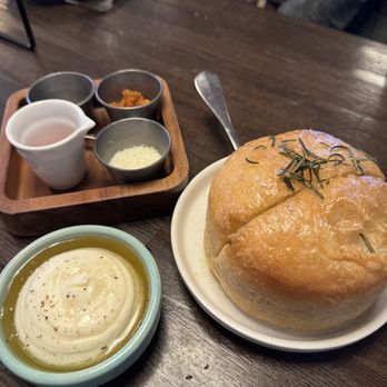 etta - house baked focaccia. assortment of pizza condiments in the back. - New American Near Me - Scottsdale, Arizona etta - house baked focaccia. assortment of pizza condiments in the back. - New American Near Me - Scottsdale, Arizona
