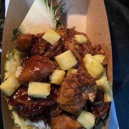 Teriyaki chicken and rice in a pineapple bowl
