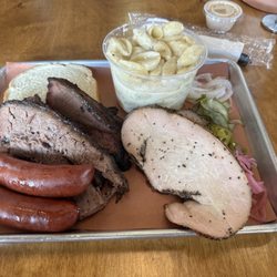 Grand Champion BBQ - Brisket, turkey, pork and turkey sausages, and mac and cheese