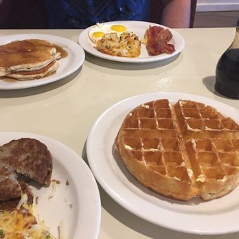 Bon Appetit Cafe - Bon Apetite breakfasts - one with sausage and waffle / other with pancakes and bacon - American Near Me - Houston, Texas