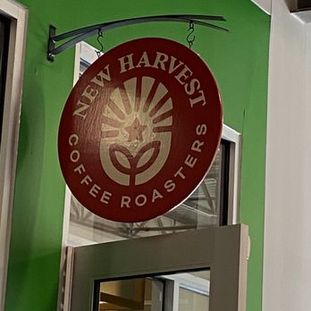 New Harvest Coffee - a sign hanging from the side of a building - Coffee Roasteries Near Me - Providence, Rhode Island New Harvest Coffee - a sign hanging from the side of a building - Coffee Roasteries Near Me - Providence, Rhode Island