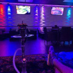 a hookah lounge with neon lights a hookah lounge with neon lights
