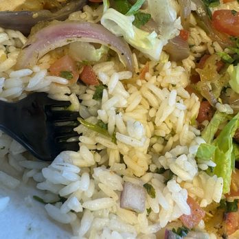 Chipotle Mexican Grill - Raw rice. Chicken bowl. Chicken burrito. - Mexican Near Me - Folsom, California