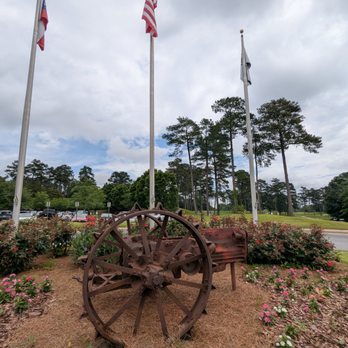 Heritage Golf Links - Old tractor out front in the circle in front of the clubhouse. Heritage Golf Links is using this as part of their branding now. - Golf Near Me - Tucker, Georgia