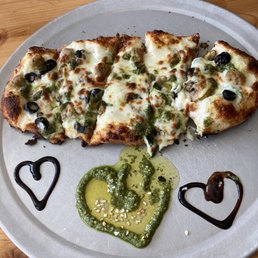 The Crooked Road minus the onions. Dip a slice in their signature balsamic vinegar and pesto The Crooked Road minus the onions. Dip a slice in their signature balsamic vinegar and pesto