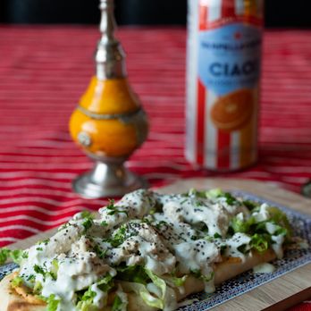 Flavors of Morocco - "The Bnina" - Our Chicken Shawarma on a Pita with our Homemade Hummus, Lettuce, White Sauce, and Chia Seeds - Moroccan Near Me - Lancaster, Pennsylvania Flavors of Morocco - "The Bnina" - Our Chicken Shawarma on a Pita with our Homemade Hummus, Lettuce, White Sauce, and Chia Seeds - Moroccan Near Me - Lancaster, Pennsylvania