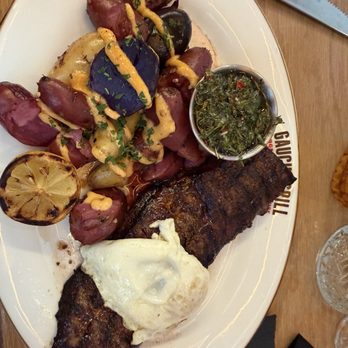 Gaucho Grill - Steak And eggs. Served with purple potatoes that were delicious and the chimichurri was amazing - Argentine Near Me - Temecula, California