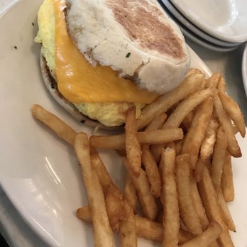 Mom's Kitchen & Bar - Breakfast sanch with Bacon and side of frenched fries. - Bars Near Me - Astoria, New York Mom's Kitchen & Bar - Breakfast sanch with Bacon and side of frenched fries. - Bars Near Me - Astoria, New York