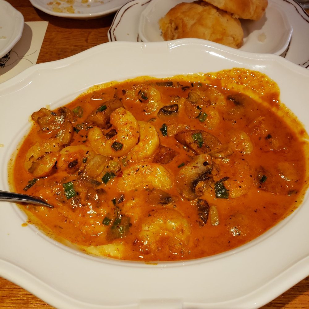 Wishbone - Cajun shrimp and grits, and cheddar biscuits in the back - Breakfast & Brunch Near Me - Chicago, Illinois Wishbone - Cajun shrimp and grits, and cheddar biscuits in the back - Breakfast & Brunch Near Me - Chicago, Illinois