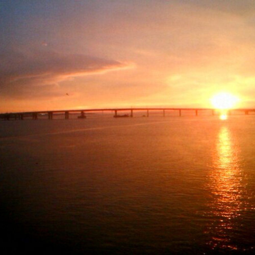 Cross Bay Veterans Memorial Bridge - The view of the Cross Bay Bridge at sunset from  the A train. - Public Transportation Near Me - Broad Channel, New York