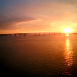Cross Bay Veterans Memorial Bridge - The view of the Cross Bay Bridge at sunset from  the A train.