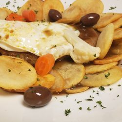 Casertano's Cucina Deli & Catering - #Bitoque 10oz sirloin steak sauteed with garlic and sherry wine sauce with egg on top. Served with Spanish potatoes.