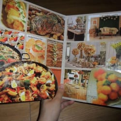 Michelin Cuisine & Fine Foods, Inc. - me reading M Catering's brochure. See the pictures of their dishes? They look so deliciouuuuus!