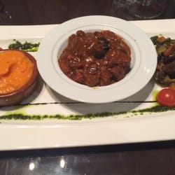 Slow cooked beef with regional spices (Like beef bourguignon) with vegetables and whipped sweet potatoes.