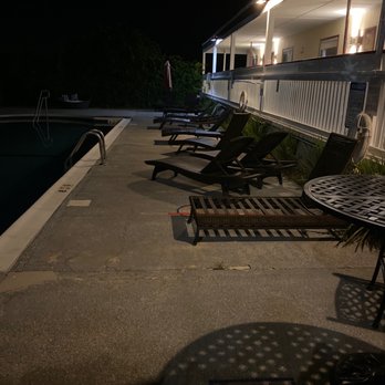 Baywatch Hotel & Marina - can't see the busted chairs since this was taken after the pools hours and it was locked. - Hotels Near Me - Hampton Bays, New York