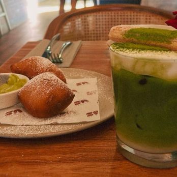 Between Us - Halfway finished beignets and matcha tiramisu with lady finger on top - Breakfast & Brunch Near Me - San Diego, California Between Us - Halfway finished beignets and matcha tiramisu with lady finger on top - Breakfast & Brunch Near Me - San Diego, California