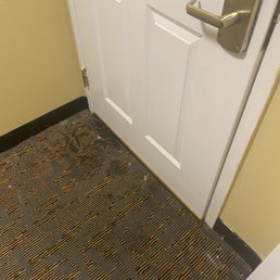 Filthy doorway inside our room. White spots kinda looks like mold.