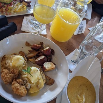 STIR - Crab and shrimp egg benedict with a side of cheddar grits - Cocktail Bars Near Me - Chattanooga, Tennessee STIR - Crab and shrimp egg benedict with a side of cheddar grits - Cocktail Bars Near Me - Chattanooga, Tennessee