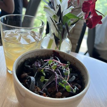 Owamni - Duck bean with some kind of bland indigenous tea ( To me, tea is very pricy, $6 for lots of ice) - New American Near Me - Minneapolis, Minnesota Owamni - Duck bean with some kind of bland indigenous tea ( To me, tea is very pricy, $6 for lots of ice) - New American Near Me - Minneapolis, Minnesota