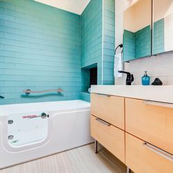 All Eco Design Center - Walk in bath with safety bars