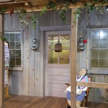 Shenandoah Heritage Market - a woman sitting on a bench in front of a store - Farmers Market Near Me - Harrisonburg, Virginia