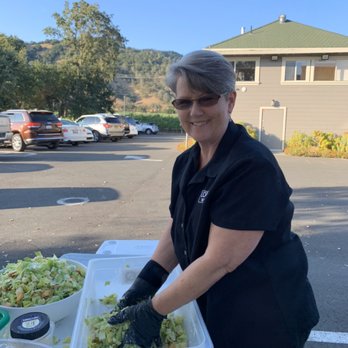 Local Q 707 - Mama Laura making Caesar salad for an event - American Near Me - Calistoga, California Local Q 707 - Mama Laura making Caesar salad for an event - American Near Me - Calistoga, California