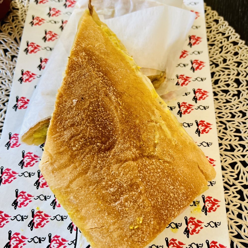 Rincon Montañero - a sandwich on a napkin - Empanadas Near Me - Palm Harbor, Florida Rincon Montañero - a sandwich on a napkin - Empanadas Near Me - Palm Harbor, Florida