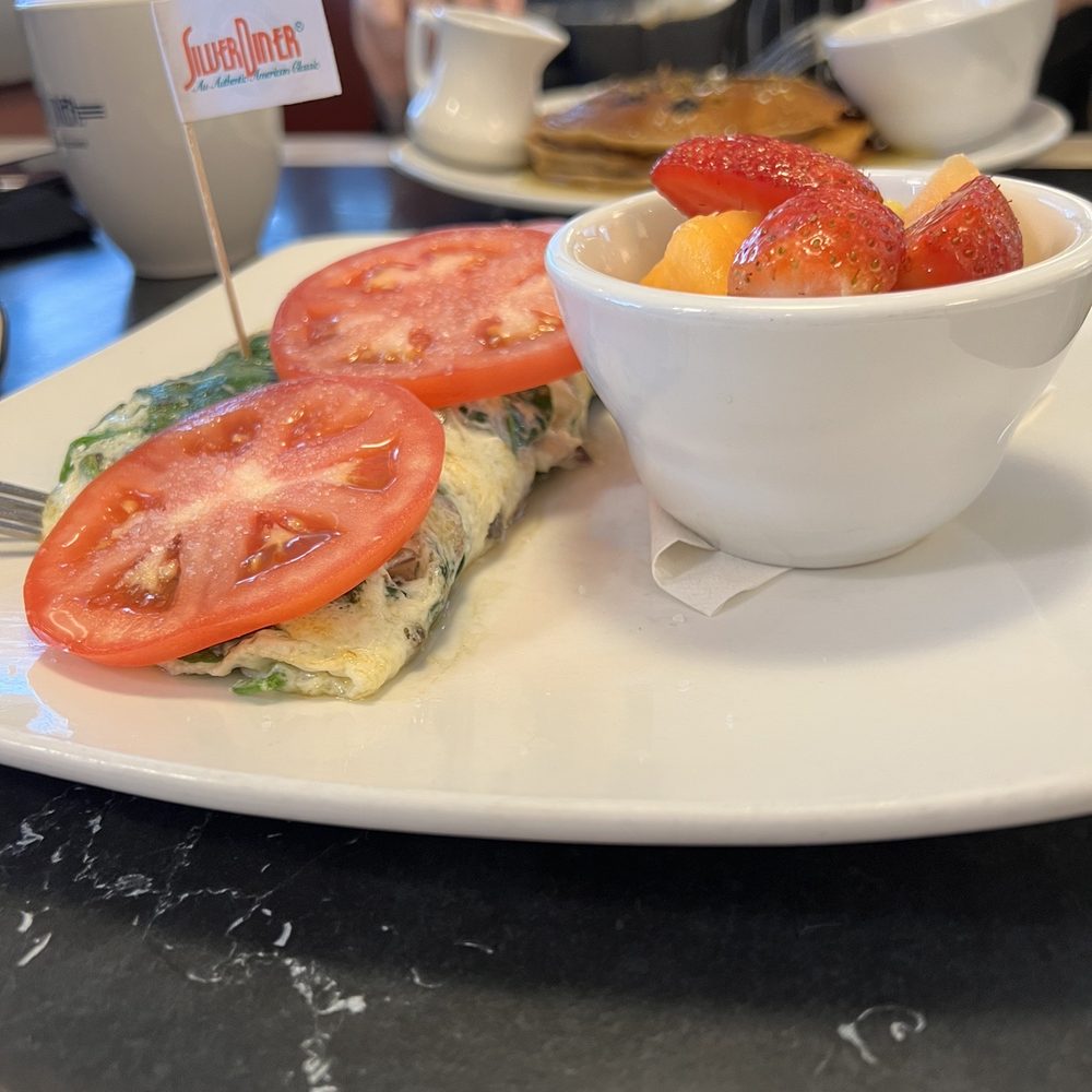 Silver Diner - Egg whites omelette with spinach and mushrooms and bowl of fruits as a side - Diners Near Me - McLean, Virginia Silver Diner - Egg whites omelette with spinach and mushrooms and bowl of fruits as a side - Diners Near Me - McLean, Virginia