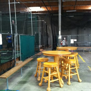 Lumberyard Baseball Academy - Seating area just outside of the cages for parents or batters waiting their turn. - Sporting Goods Near Me - San Marcos, California Lumberyard Baseball Academy - Seating area just outside of the cages for parents or batters waiting their turn. - Sporting Goods Near Me - San Marcos, California