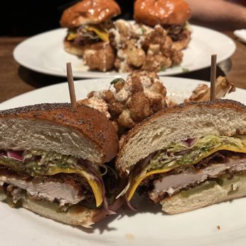 Cork & Pig Tavern - two sandwiches on a plate - New American Near Me - San Angelo, Texas Cork & Pig Tavern - two sandwiches on a plate - New American Near Me - San Angelo, Texas